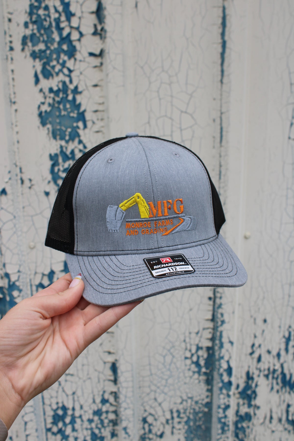 GRAY AND BLACK TRUCKER HAT